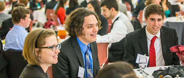 students at dinner event