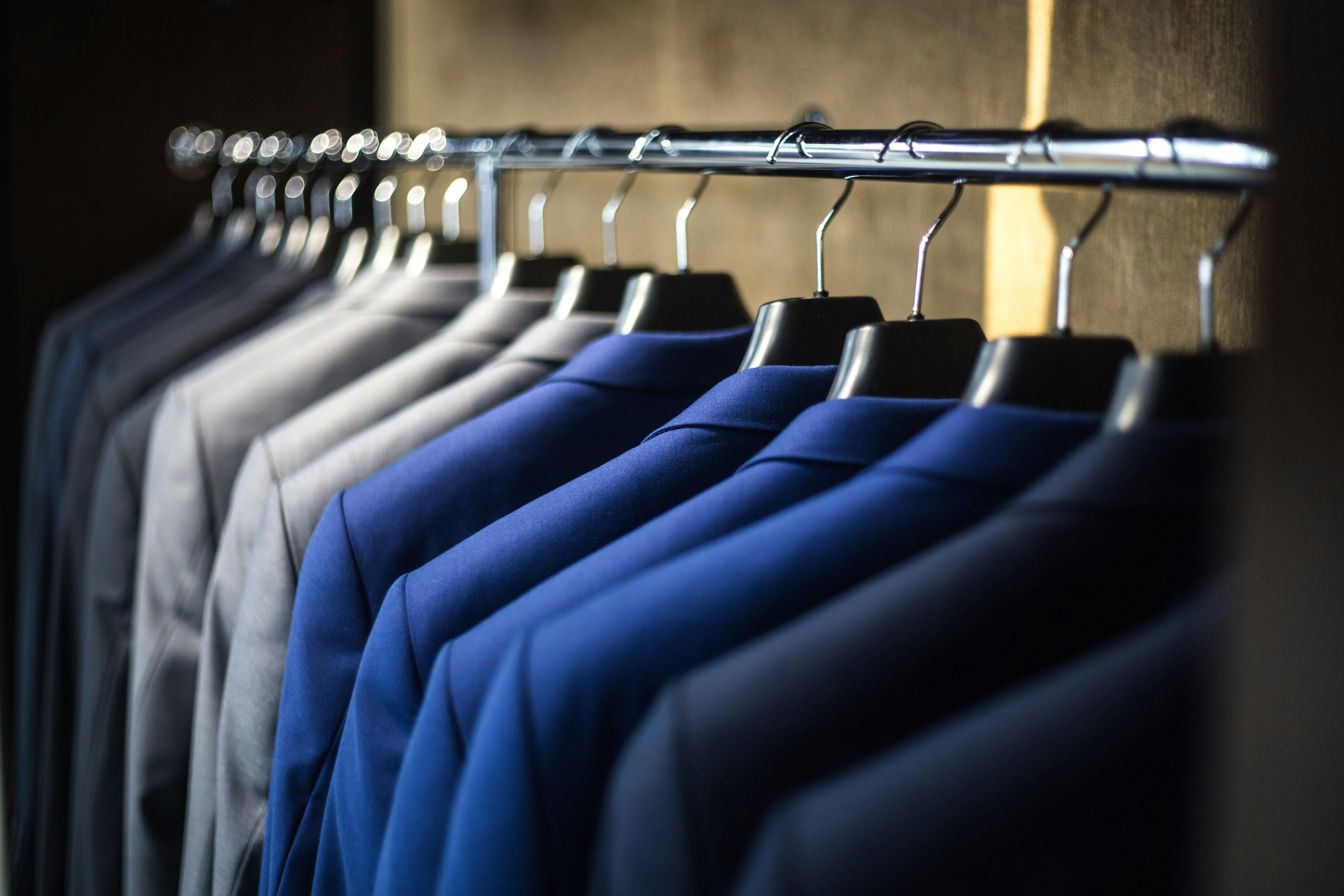 suit jackets on a clothing rack