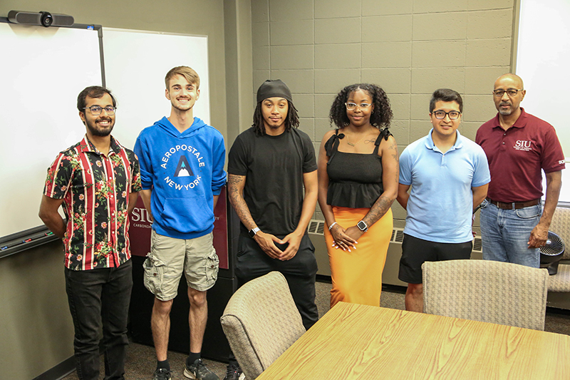 COBA Dean Student Advisory Board students in a classroom with Dean Marc Morris