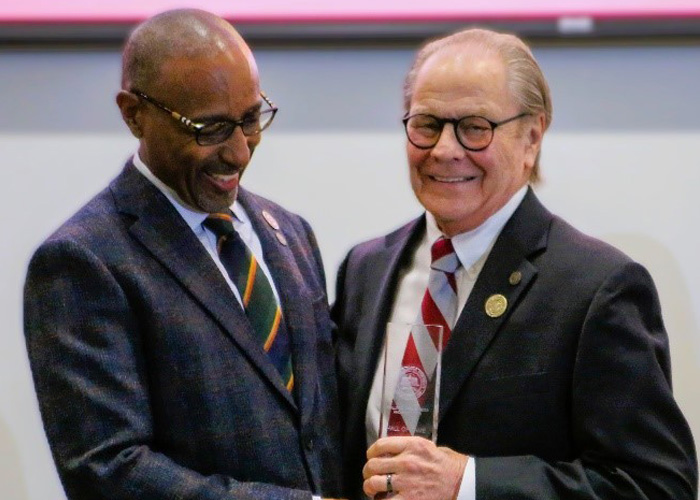 Person accepting hall of fame award